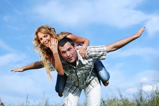 man and woman hug in the sky