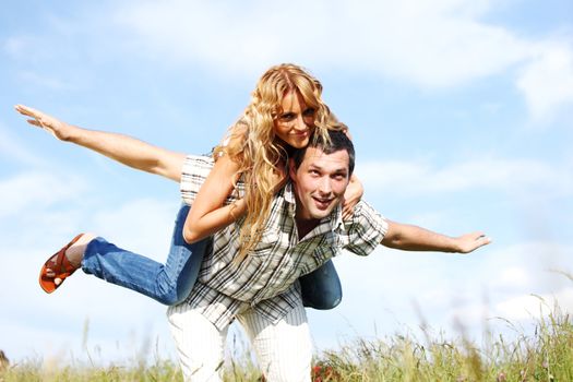man and woman hug in the sky
