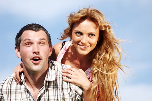 man and woman hug in the sky