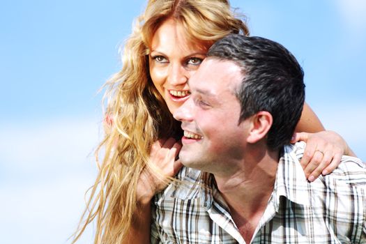 man and woman hug in the sky