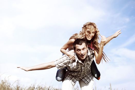 man and woman hug in the sky