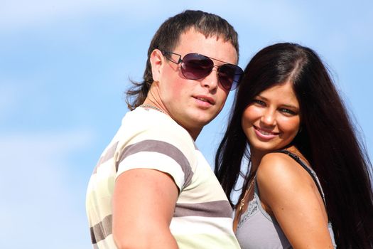 man and woman hug sky on background