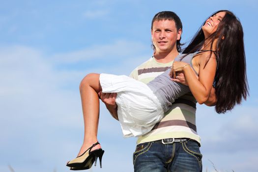 man and woman hug sky on background