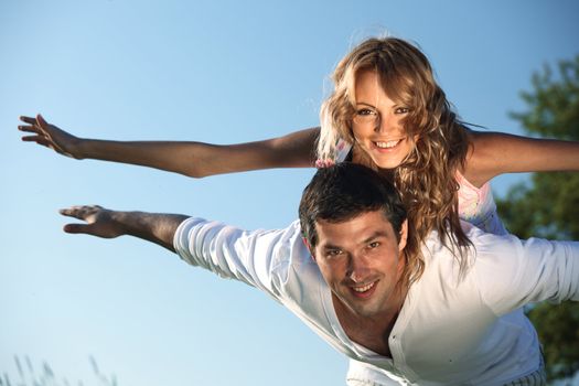 man and woman hug in the sky