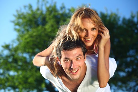 man and woman hug in the sky