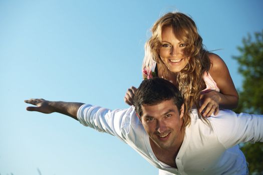 man and woman hug in the sky