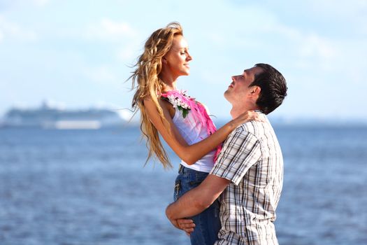 man and woman hug in the sky and sea on sea