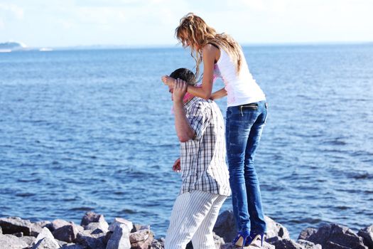 man and woman hug in the sky and sea on sea