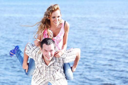 man and woman hug in the sky and sea on sea