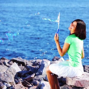 woman relax blue sea and bubbles on background