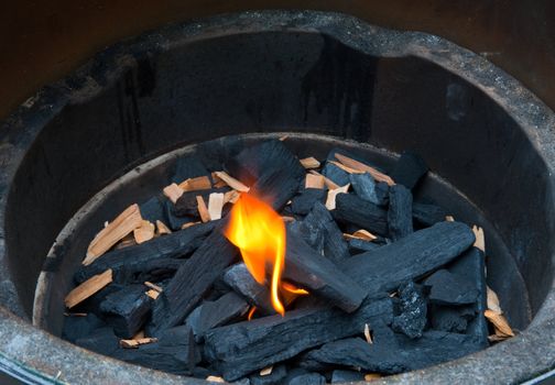 Flame and charcoal in a bbq grill