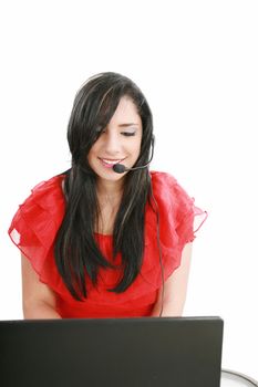 Young Woman with a headset and computer at Hotline.