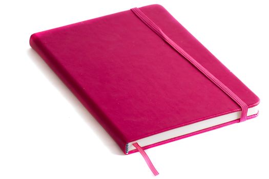 Closed notebook on a white background