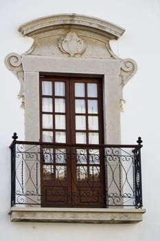Close detail view of a Portuguese window of a building. 