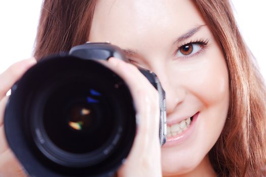 smiling woman with a professional camera isiolated