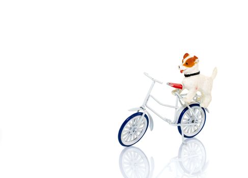 toy dog on white bike