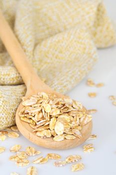 oat-flakes with a wooden spoon