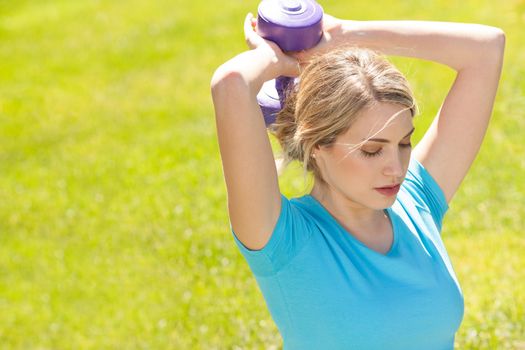 Young sport woman lift weight work out outdoors