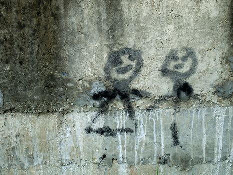 Black Spray paint of Man and Woman on cement wall