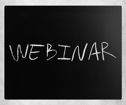 The word "Webinar" handwritten with white chalk on a blackboard.