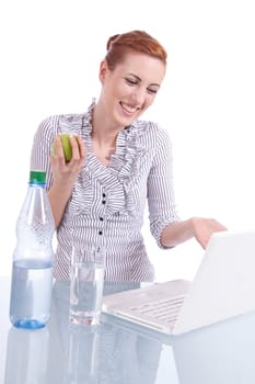 young business woman on computer with snack isolated on white