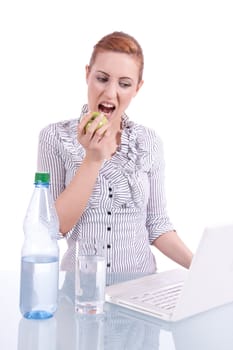 young business woman on computer with snack isolated on white