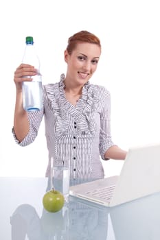 young business woman on computer with snack isolated on white