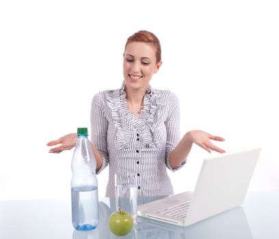 young business woman on computer with snack isolated on white