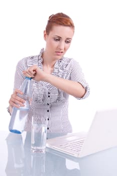 young business woman on computer with snack isolated on white