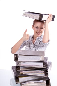 business woman in office looks at unbelievable folder stack isolated on white