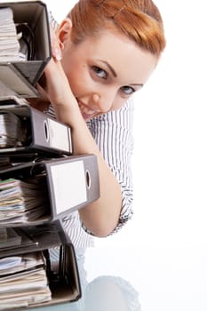 business woman in office looks at unbelievable folder stack isolated on white