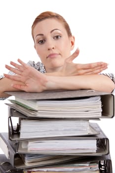 business woman in office looks at unbelievable folder stack isolated on white