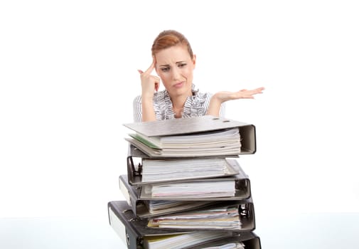 business woman in office looks at unbelievable folder stack isolated on white