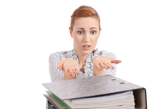 business woman in office looks at unbelievable folder stack isolated on white