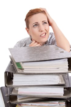 business woman in office looks at unbelievable folder stack isolated on white