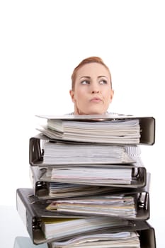 business woman in office looks at unbelievable folder stack isolated on white