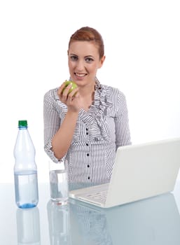 young business woman on computer with snack isolated on white