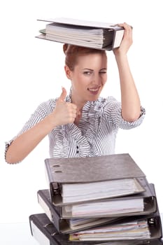 business woman in office looks at unbelievable folder stack isolated on white