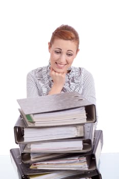 business woman in office looks at unbelievable folder stack isolated on white