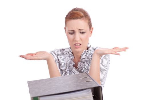 business woman in office looks at unbelievable folder stack isolated on white