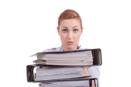 business woman in office looks at unbelievable folder stack isolated on white