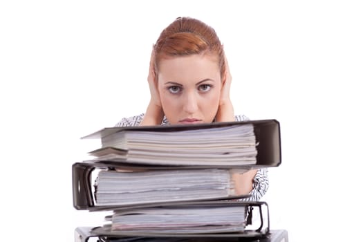 business woman in office looks at unbelievable folder stack isolated on white
