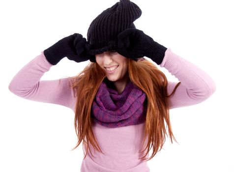 young beautiful woman with hat gloves and scarf in winter isolated on white