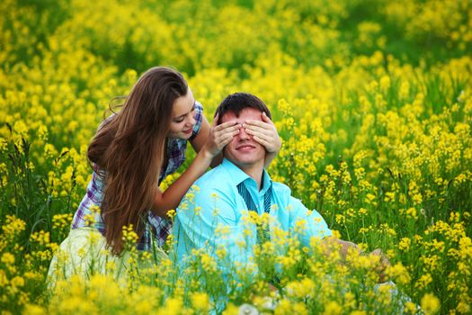 lovers hug on yellow flower field