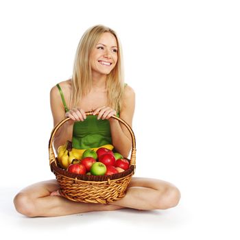 woman holds a basket of fruit on a white background