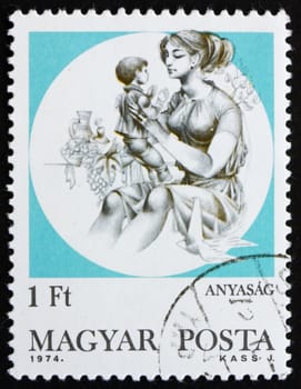 HUNGARY - CIRCA 1974: a stamp printed in the Hungary shows Mother and Child, Motherhood, circa 1974