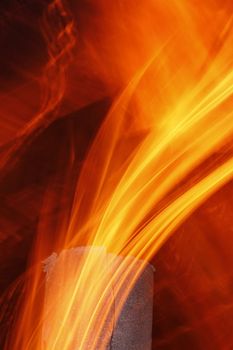 Abstract flame texture with old metal chimney at night