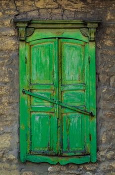 Old-fashioned style window in old wall