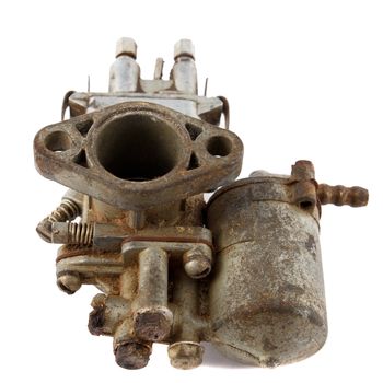 dirty old motorcycle carburetor on a white background