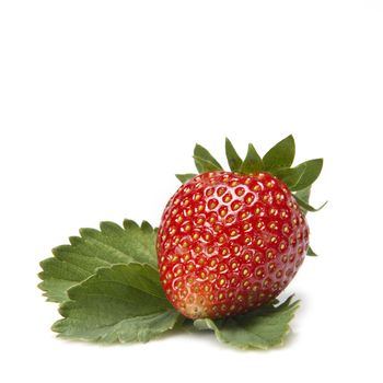 Strawberry  with its  leaves isolated on a white background